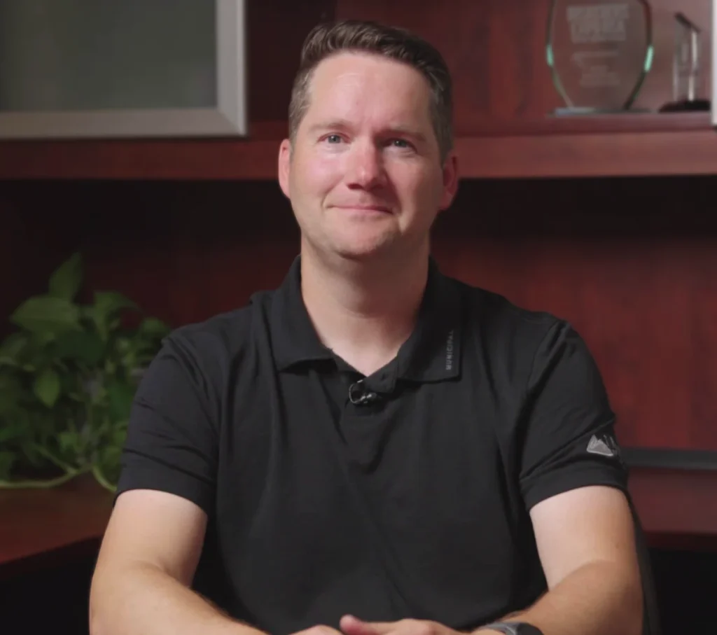 Corporate leadership portrait in an office environment with recognition awards